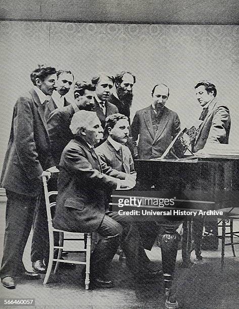 Founding committee of the Société musicale indépendente 1909. Gabriel Faure and Jean Roger-Ducasse , French composers, at the piano, accompanied,...