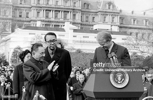 Photograph of the Chinese Vice Premier Deng Xiao Ping applauding President of the United States Jimmy Carter at the White House. Dated 1979.