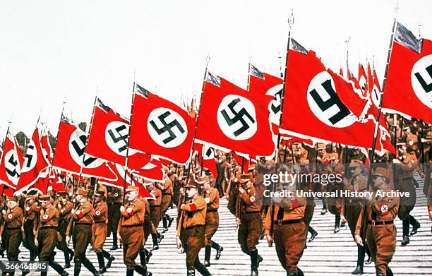 Swastika adorned flags carried at a Nazi Rally in Germany, 1934.