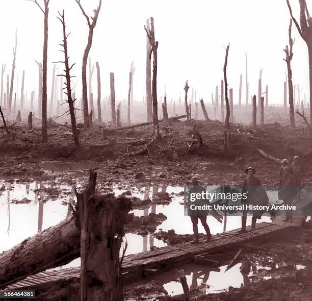 Photograph of World War One Australian soldiers passing through mud fields at Chateau Wood, near Hooge in the Ypres region, October 1917.