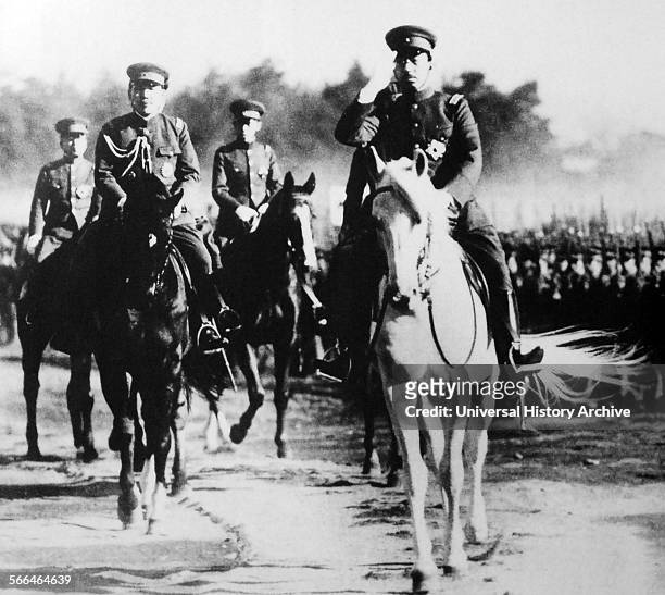 Emperor Hirohito of Japan on horseback, reviewing troops of the Japanese Army 1938.