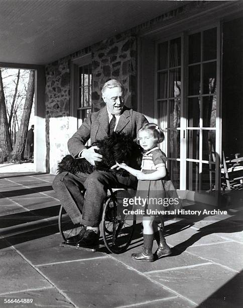 Franklin D. Roosevelt with Fala his dog and Ruthie Bie in Hyde Park, New York, 1941. There were few images taken showing President Roosevelt in his...