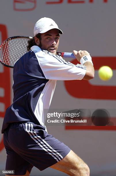 Nicolas Massu of Chile plays a backhand during his first round match against Galo Blanco of Spain during the Open Seat Godo in Barcelona, Spain on...