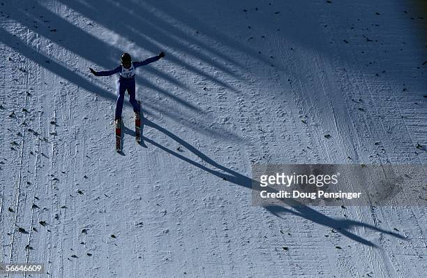 Nick Alexander displays a telemark landing as he jumps during the Ragnar Cup in the Men's K90 US Ski Jumping Championships at Howelsen Hill on...