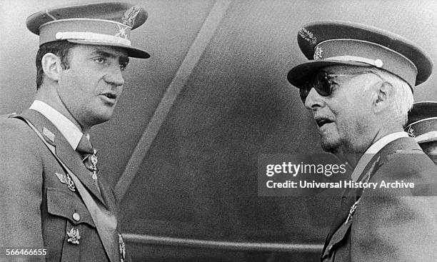 General Francisco Franco with his heir apparent Prince Juan Carlos at a military ceremony in Madrid in 1972.