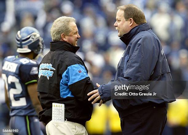 Head Coach Mike Holmgren of the Seattle Seahawks greets Head Coach John Fox of the Carolina Panthers during pregame warmups prior to the NFC...