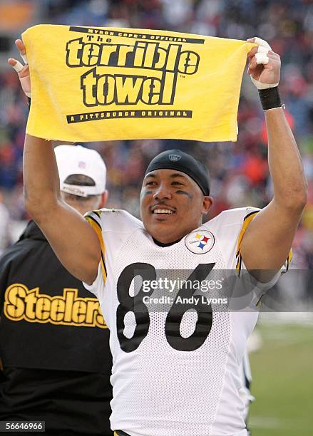 Hines Ward of the Pittsburgh Steelers holds up a terrible towel in celebration in the final minute of the Steelers' 34-17 win over the Denver Broncos...