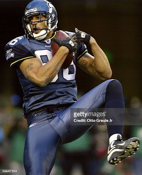 Tight end Jerramy Stevens of the Seattle Seahawks scores a touchdown on a pass from quarterback Matt Hasselbeck in the first quarter during the NFC...