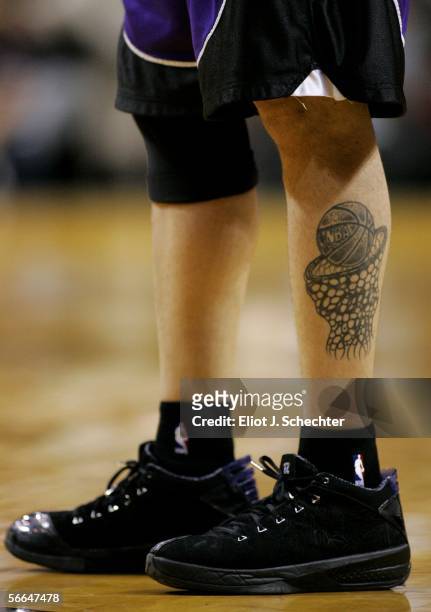 The tattoo of guard Mike Bibby of the Sacramento Kings is seen during a game against the Miami Heat on January 22, 2006 at the American Airlines...