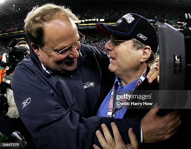 Seattle Seahawks head coach Mike Holmgren hugs Seahawks owner Paul Allen after their victory over the carolina Panthers in the NFC Championship Game...