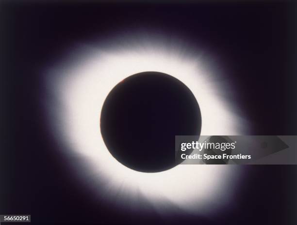 The corona of the sun visible around the moon during a total solar eclipse, Guadeloupe, 26th February 1998.