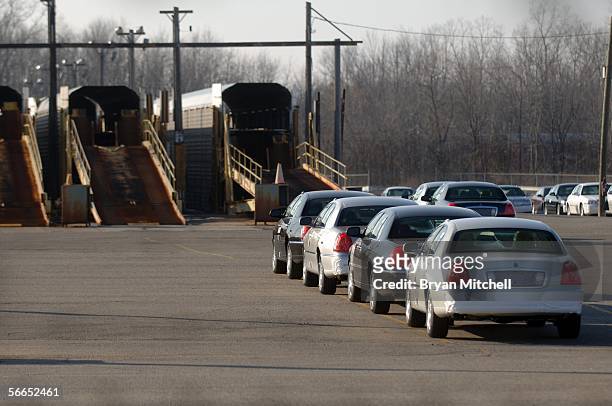 Lincoln Town Cars sit in the parking lot outside the Ford Motor Company Wixom plant January 23, 2006 in Wixom, Michigan. Ford announced today that...