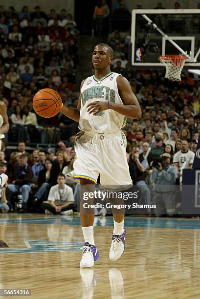 Chris Paul of the New Orleans/Oklahoma City Hornets drives against the Charlotte Bobcats during the game at the Ford Center on January 2, 2006 in...