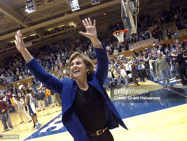 Coach Gail Goestenkors of the Duke Blue Devils waves to the fans as she leaves the floor after a win over the Tennessee Volunteers January 23, 2006...