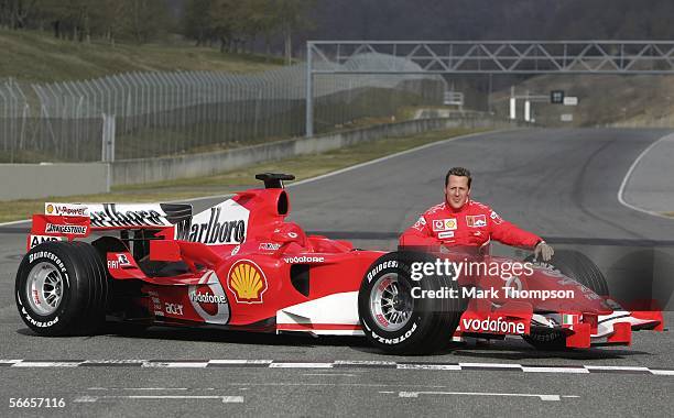 Michael Schumacher of Germany poses with the Ferrari 248 F1 during the launch of the new Ferrari F1 car for the Season 2006 on January 24, 2006 in...