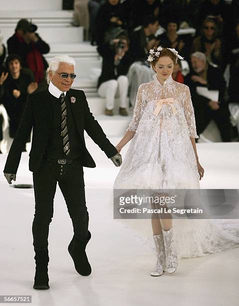 Fashion designer Karl Lagerfeld is seen on the catwalk with one of his model during the Chanel Fashion show at the Grand Palais on January 24, 2006...