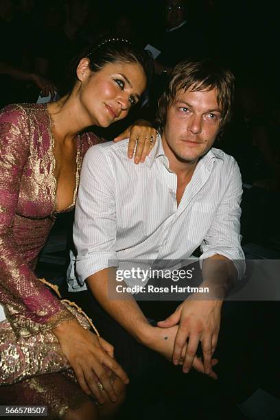 Danish fashion model and photographer, Helena Christensen and American model and actor, Norman Reedus attending the Marc Jacobs Spring 2003 fashion...