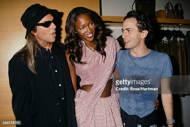 American fashion photographer Steven Meisel, English model Naomi Campbell, and American fashion designer Marc Jacobs at the Louis Vuitton store...