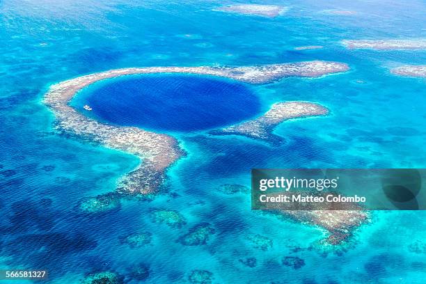 aerial of the blue hole, lighthouse reef, belize - great blue hole stock pictures, royalty-free photos & images