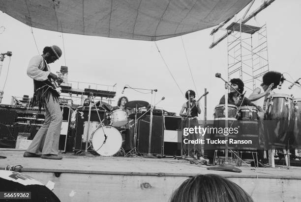 American bassist David Brown performs with the other members of Santana, including drummer Michael Shrieve , Mexican-born bandleader Carlos Santana ,...
