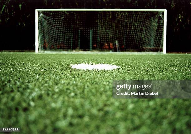 view of a goalpost on a soccer field at night - fotbollsmål bildbanksfoton och bilder