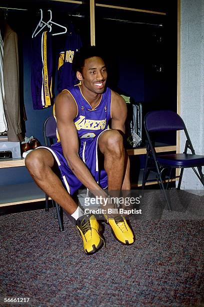 Kobe Bryant of the Western Conference All-Stars ties his sneaker in the locker room prior to the 2002 NBA All-Star Game on February 10, 2002 at the...