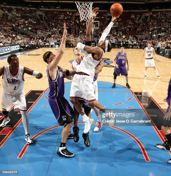 Allen Iverson of the Philadelphia 76ers shoots against Brad Miller of the Sacramento Kings on January 24, 2006 at the Wachovia Center in...