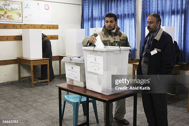 Palestinian man votes in the Palestinian legislative election at a UN school which is being used as a polling station, January 25 in Gaza City, Gaza...