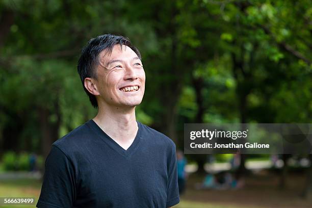 portrait of a man smiling to the camera - 40代 男性 ストックフォトと画像