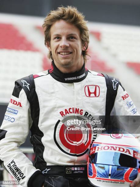 Honda driver Jenson Button of Great Britain poses during a photocall for the new Honda RA106 F1 car at the Circuito de Catalunya on January 25 in...