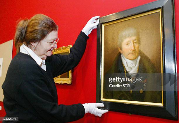Restorer Stefanie Flinsch places a portrait of bandmaster and Mozart's rival in Vienna, Antionio Salieri, a portrait by Joseph Willibrord Maehler in...