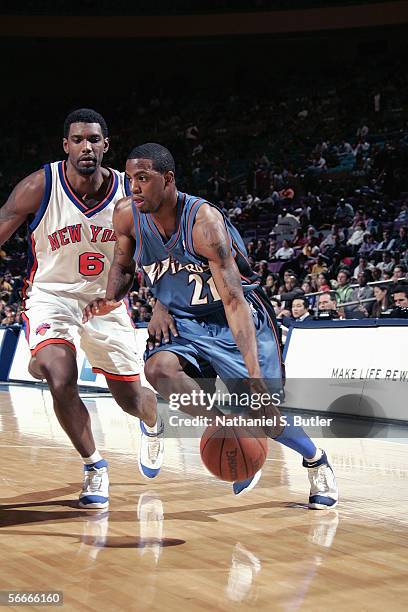 Donell Taylor of the Washington Wizards dribbles against Qyntel Woods of the New York Knicks on January 6, 2006 at Madison Square Garden in New York,...