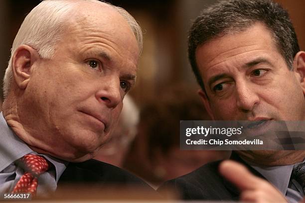 Sens. John McCain and Russell Feingold talk during a Homeland Security and Governmental Affairs committee meeting on lobby reform January 25, 2006 on...