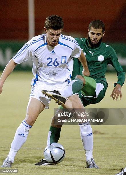 GreeK player Mantzioz Evangelos vies with Saudi player Abdulaziz Al Khathran during an international friendly match in Riyadh 25 January 2006. AFP...