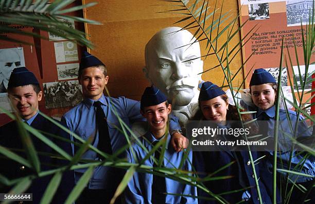 Young Transnistrians from a military school stand next to Lenin's statue in the non-recognized Republic of Transnistria August, 2001 in Tiraspol,...