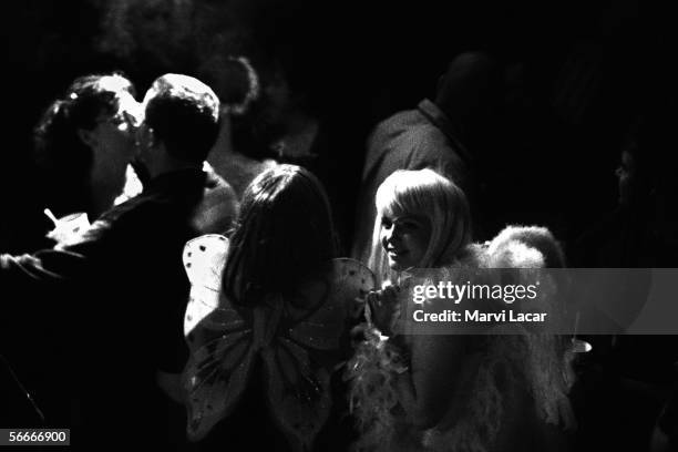 Revelers inside Fat Tuesdays celebrate halloween on October 21, 1999 in Austin, Texas.