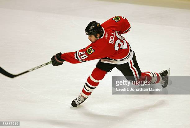 Mark Bell of the Chicago Blackhawks passes the puck during the game against the Pittsburgh Penguins on January 13, 2006 at the United Center in...