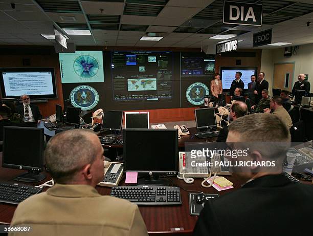 Experts man their stations at the Threat Operations Center inside the National Security Agency 25 January 2006 in suburban Fort Mead, Maryland. US...