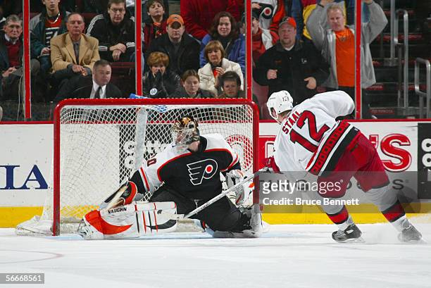 Goaltender Antero Niittymaki of the Philadelphia Flyers guards the net against Eric Staal of the Carolina Hurricanes on January 17, 2006 at the...