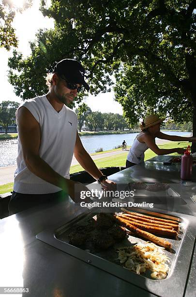 Nicolas Kiefer of Germany enjoys a barbeque on the banks of the Yarra River during day eleven of the Australian Open January 26, 2006 in Melbourne,...