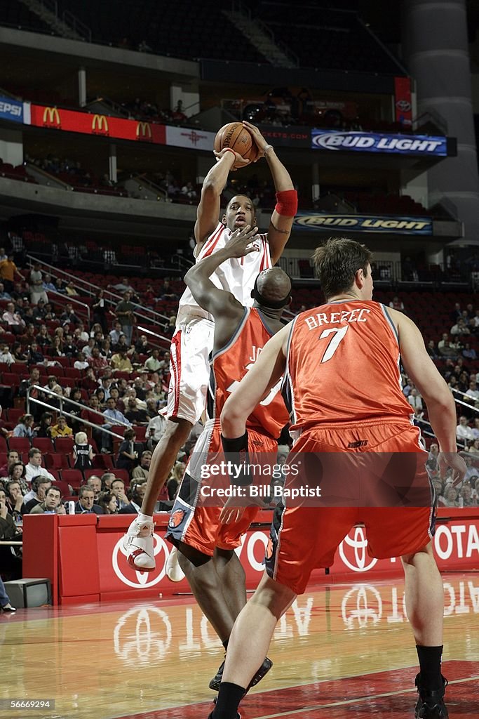 Jones Houston Rockets Tracy McGrady of the Houston Rockets shoots over Jumaine Jones of the ...