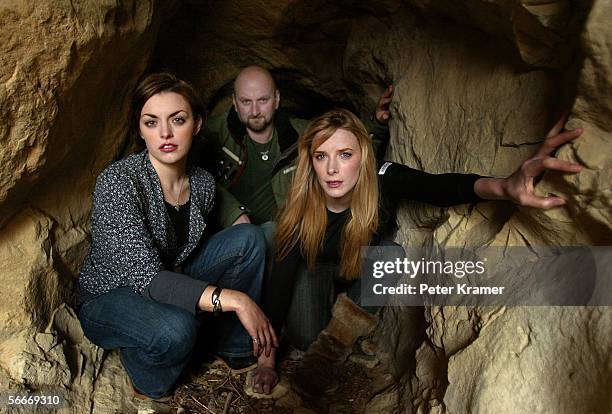Director Neil Marshall, actress Nora Jane Noone and actress Shanua Macdonald pose for portraits outside a cave entrance during the 2006 Sundance Film...