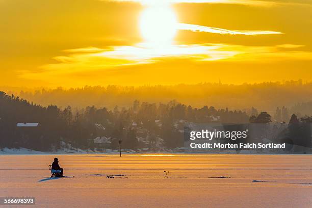ice fisherman - bærum stock pictures, royalty-free photos & images
