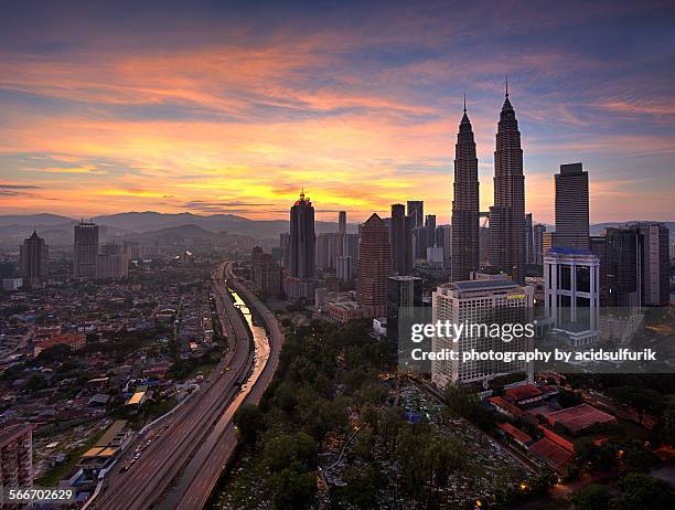 sunrise on kuala lumpur skyline - association of southeast asian nations stock pictures, royalty-free photos & images