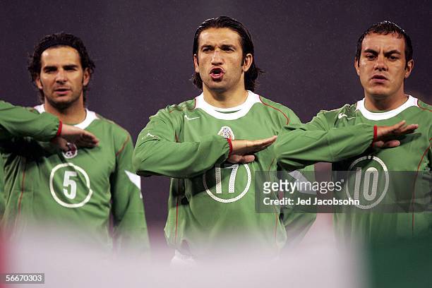 Duilio Davino, Francisco Fonseca and Cuauhtemoc Blanco of Mexico listen to the Mexican anthem before the Mexico v Norway friendly soccer match on...