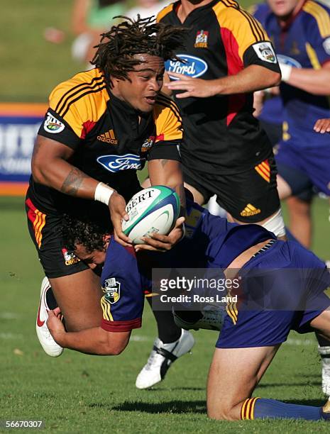 Sione Lauaki of the Chiefs tackled by Jason Kawau during the Highlanders versus Chiefs Super 14 pre-season rugby match played at the Events Centre on...