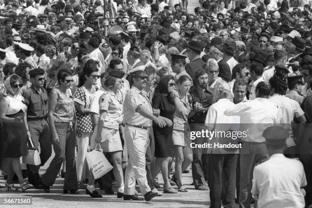 In this handout photo supplied by GPO, grieving relatives of the 11 Israeli athletes murdered by Palestinian gunmen in the Munich Olympics arrive to...