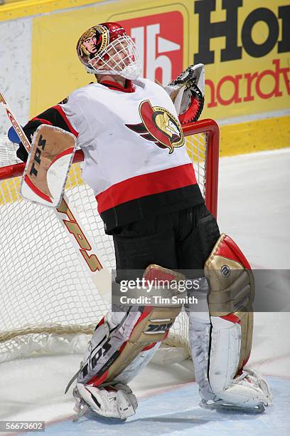 Goaltender Dominik Hasek of the Ottawa Senators leans over the net during the game against the Edmonton Oilers on January 14, 2006 at Rexall Place in...