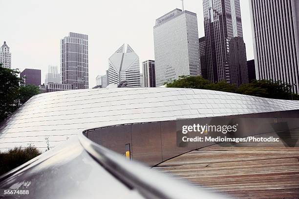 low angle view of buildings in a city, aon center, two prudential plaza, chicago, illinois, usa - millennium park chicago fotografías e imágenes de stock