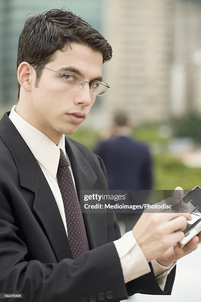 Personal Data Assistant Example Portrait Of A Businessman Operating A Personal Data Assistant Photo ...